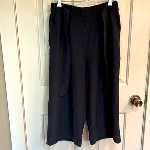 Black Lululemon wide legged crop pants.